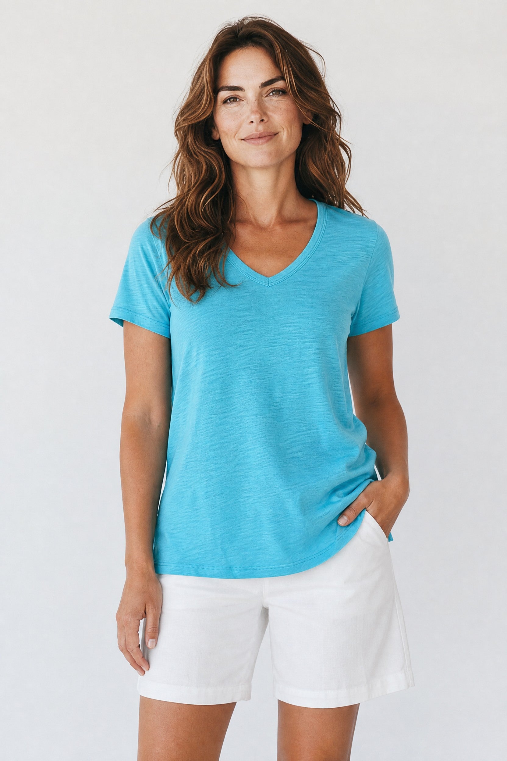 Woman wearing the Dylan teal v-neck tee Jilli Boutique
