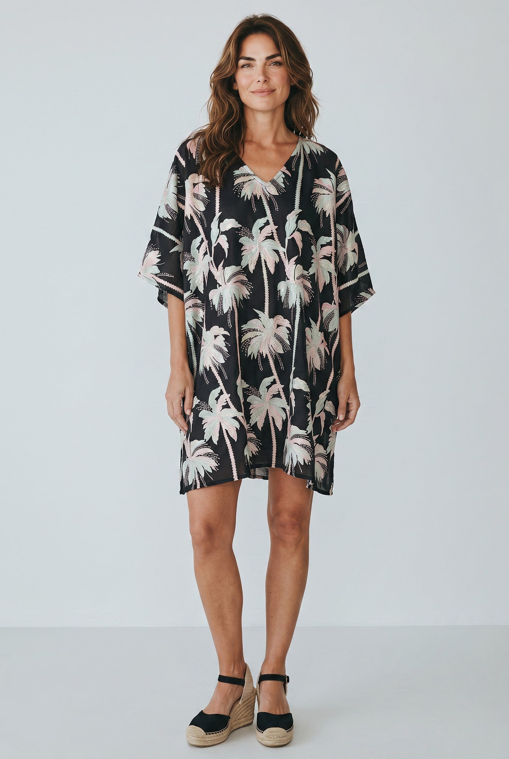 Woman wearing the Tela Mercantile Black Palm Trees Dress Jilli Boutique