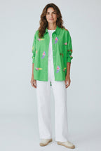 Woman wearing the Tela Mercantile Mermaid Top in Green Jilli Boutique
