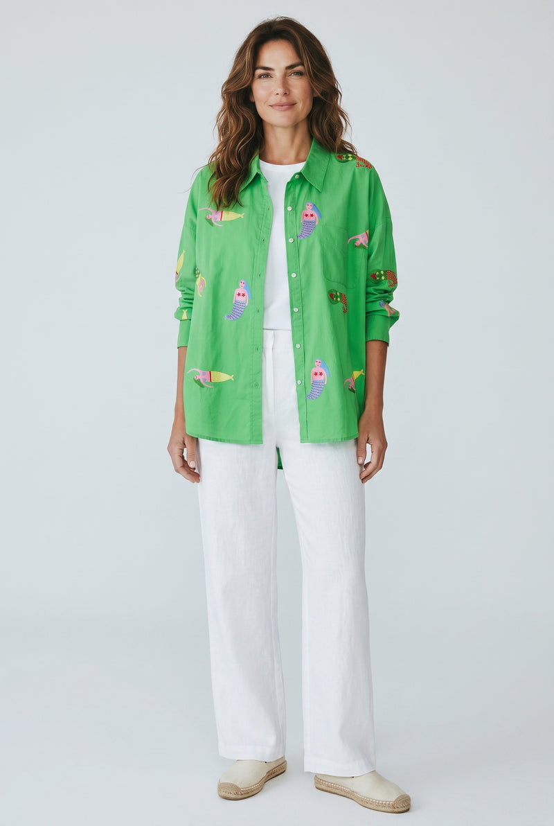 Woman wearing the Tela Mercantile Mermaid Top in Green Jilli Boutique

